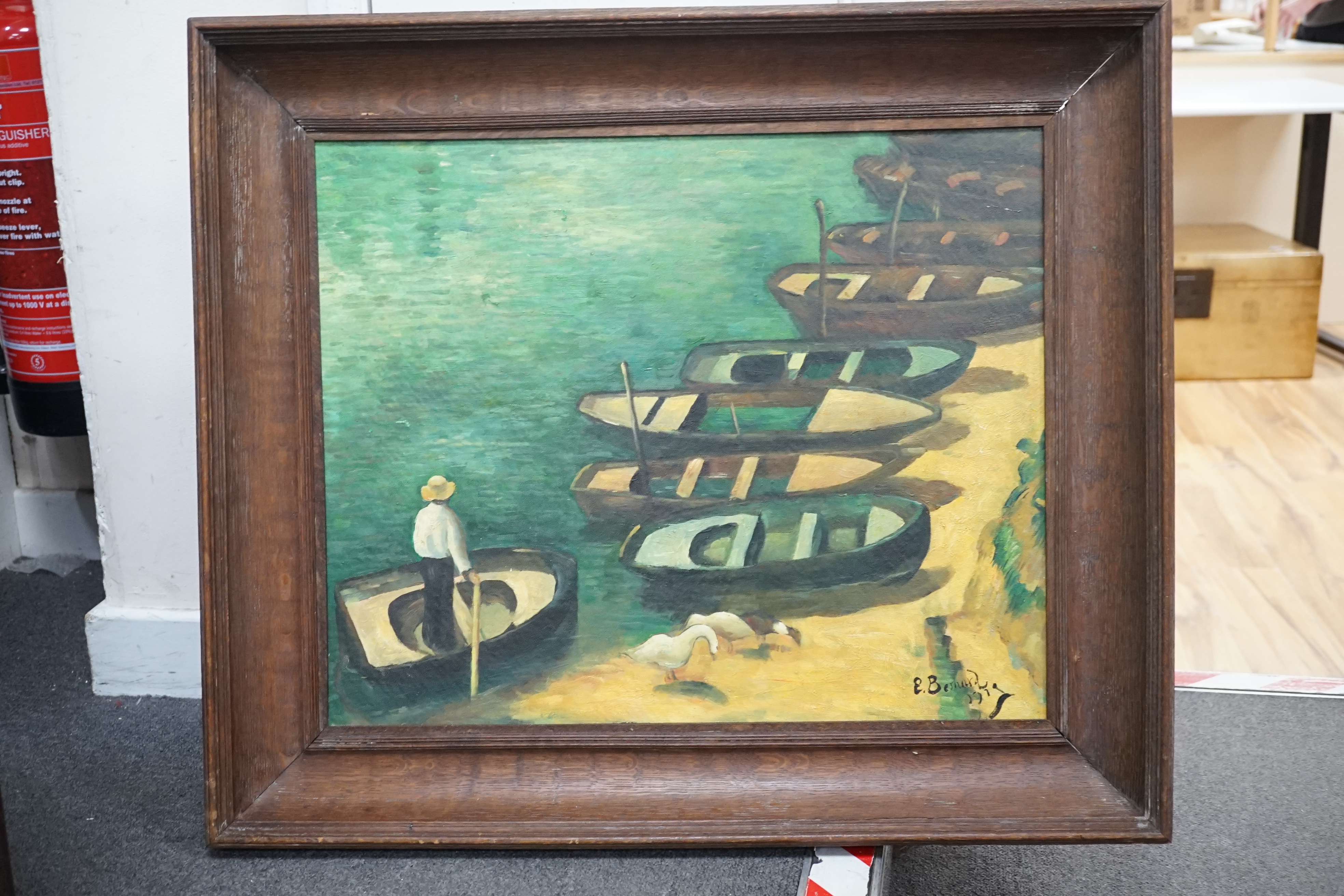 After Émile Henri Bernard (1868-1941), oil on board, Figure and beached boats along the shore, bears signature and date 1919, 48 x 59cm